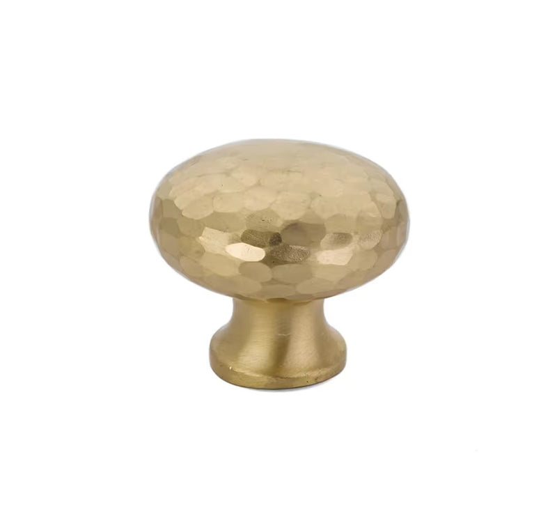 The Emtek Arts & Crafts Round Dimpled Knob in Satin Brass finish.