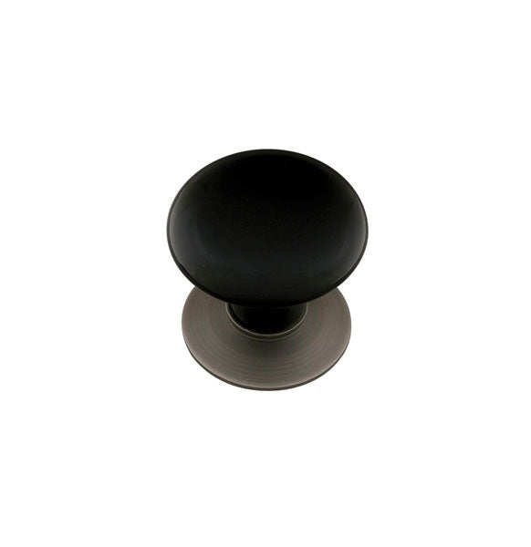 The Emtek Ebony Porcelain Cabinet Knob in Pewter finish