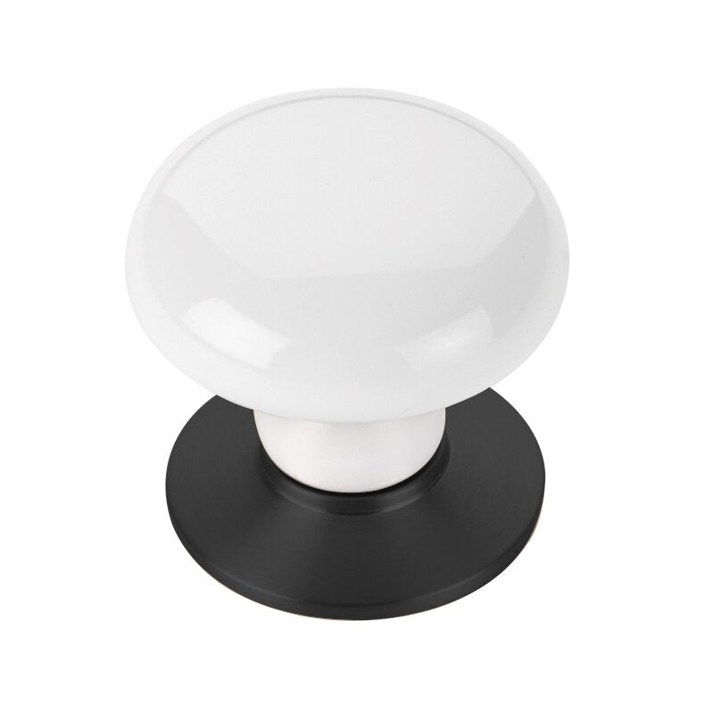 The Emtek Ice White Porcelain Cabinet Knob in Flat Black finish