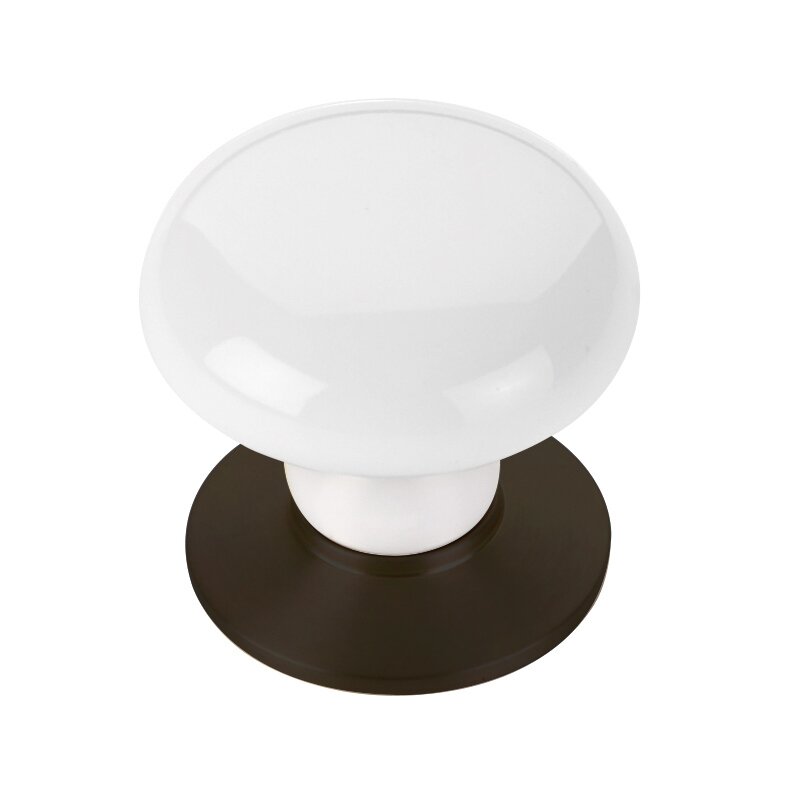 The Emtek Ice White Porcelain Cabinet Knob in Oil Rubbed Bronze finish