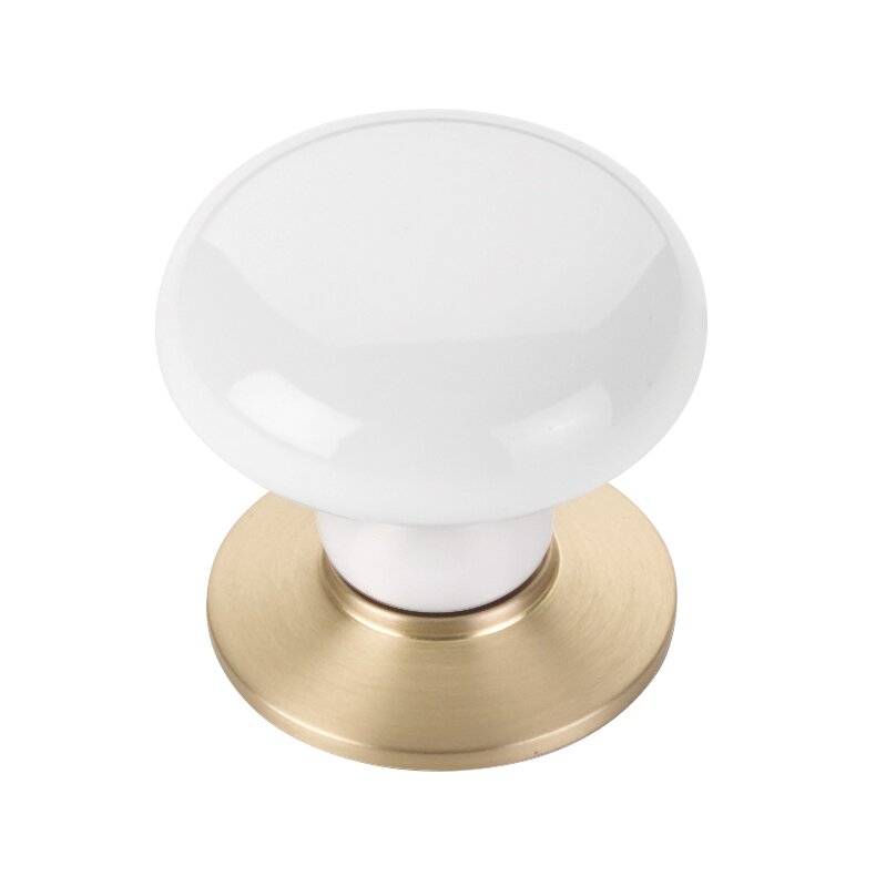 The Emtek Ice White Porcelain Cabinet Knob in Satin Brass finish