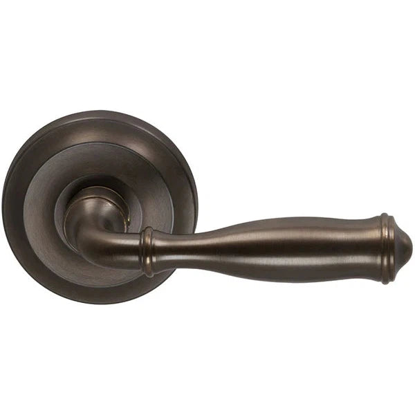 The Omnia Traditions 944 Lever with Round Rosette in Antique Bronze, Unlacquered finish