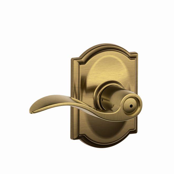 Schlage Accent Privacy Lever With Camelot Rosette in Antique Brass finish