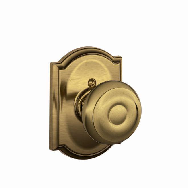 Schlage Georgian Knob Half Dummy With Camelot Rosette in Antique Brass finish