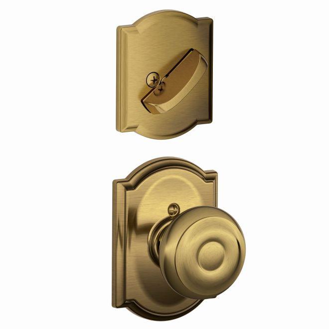 Schlage Georgian Knob With Camelot Rosette Interior Active Trim - Exterior Handleset Sold Separately in Antique Brass finish