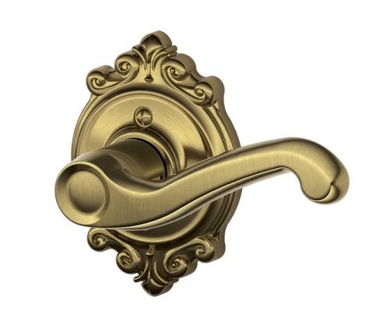 Schlage Right Hand Flair Lever With Brookshire Rosette Half Dummy in Antique Brass finish