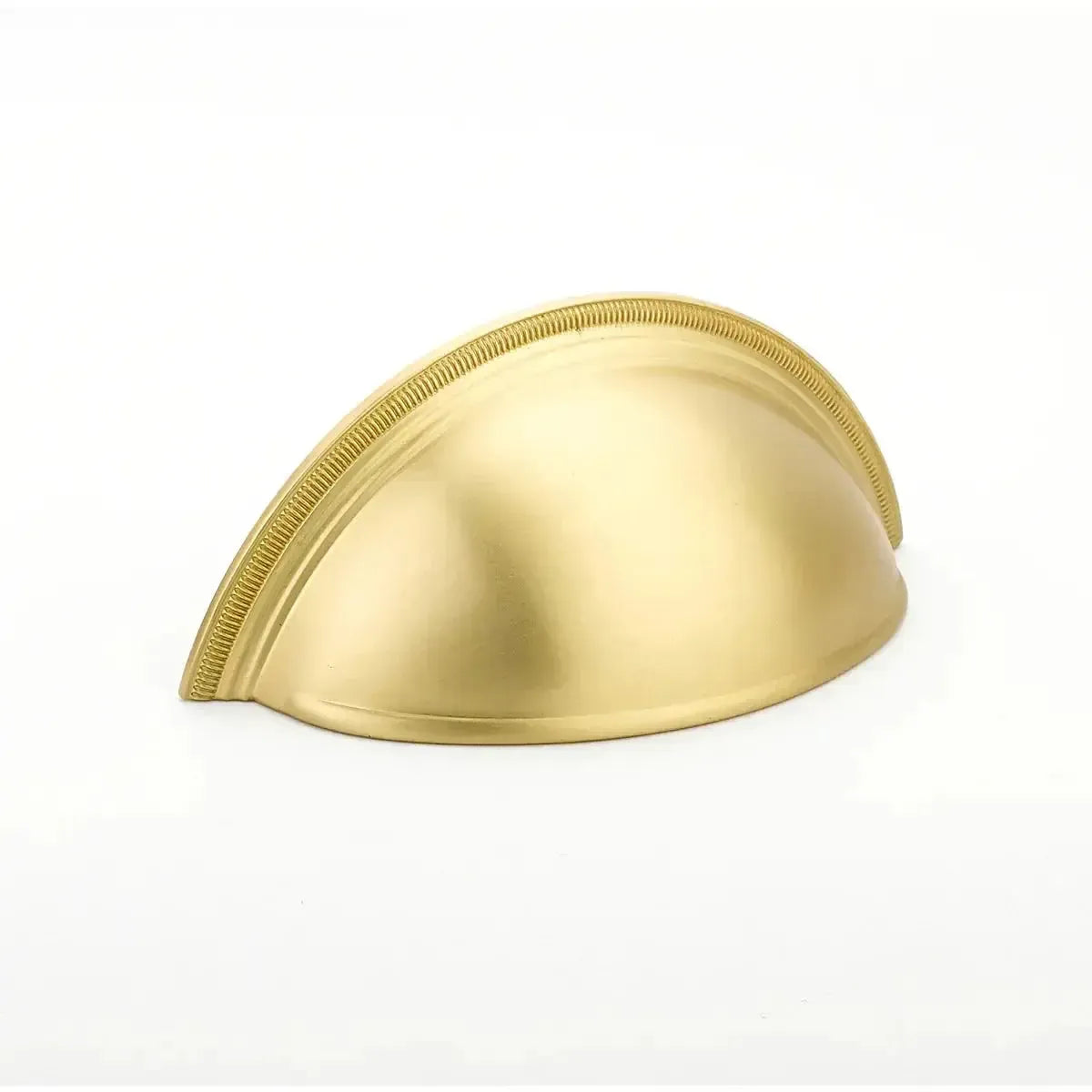 The Schaub Atherton Plain Surface Knurled Edge Cup Pull in Satin Brass finish.