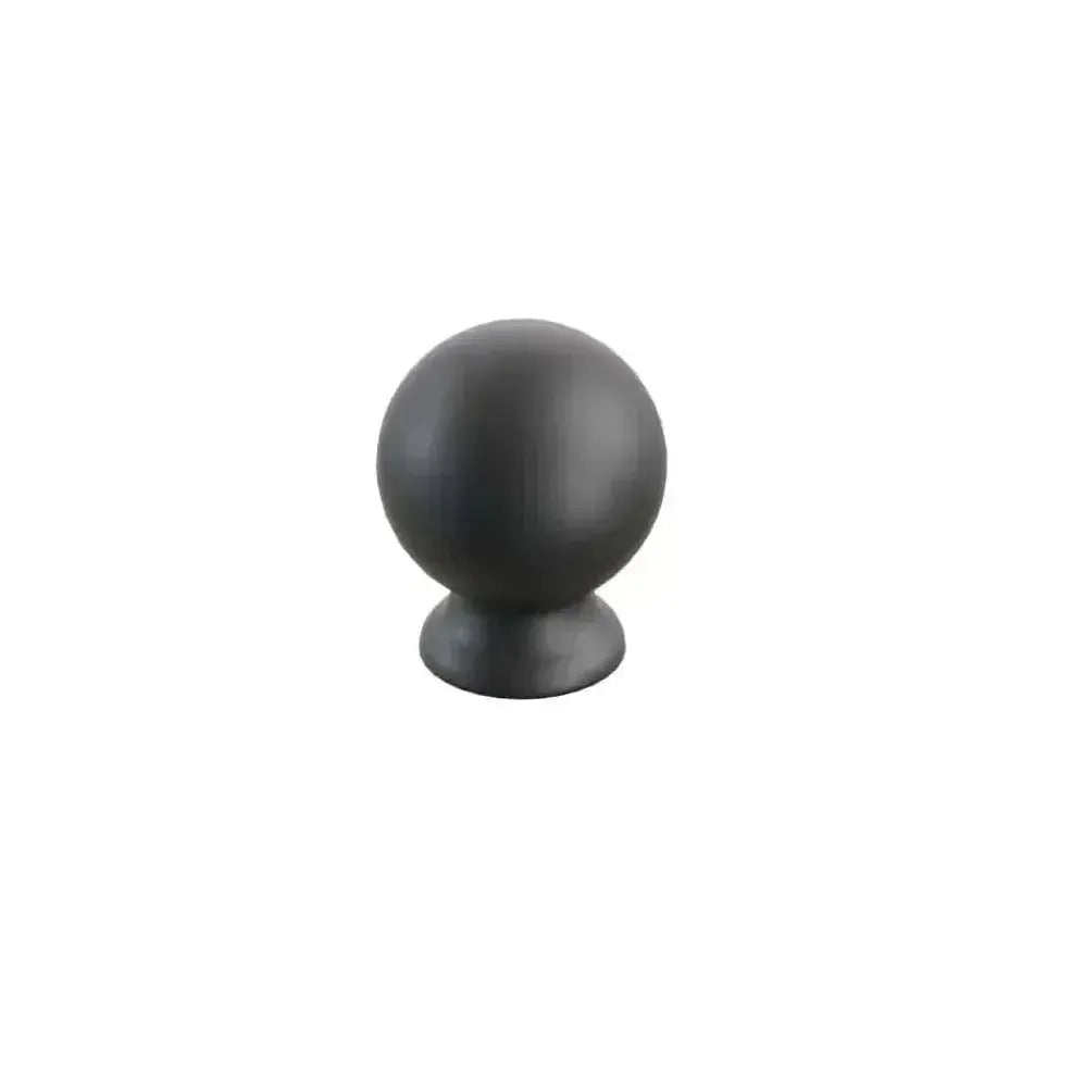 The Schaub Avenue Round Cabinet Knob in Matte Black finish.