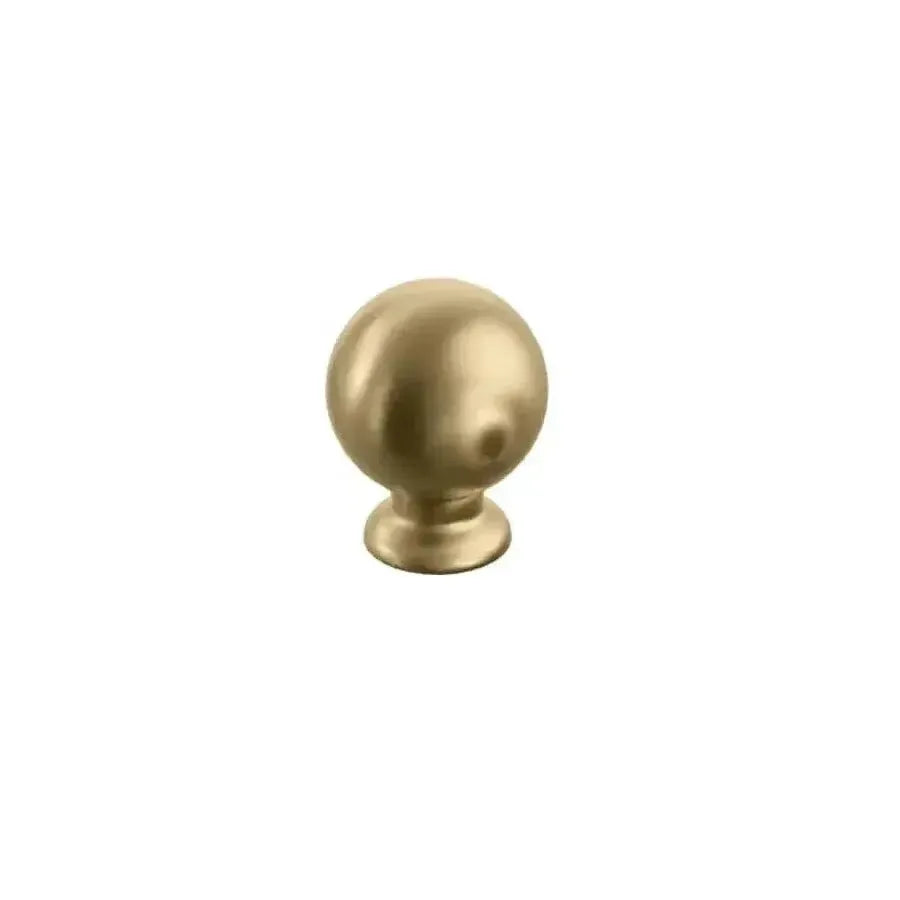 The Schaub Avenue Round Cabinet Knob in Vintage Brass finish.