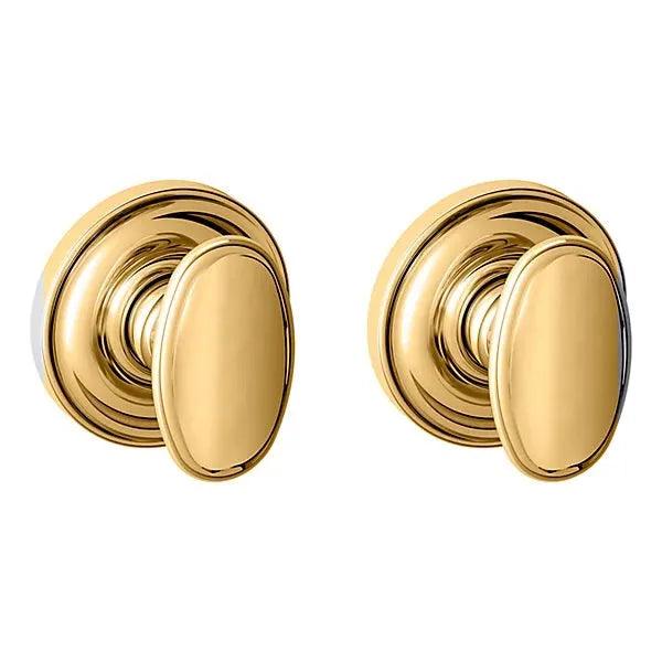 The Baldwin Estate 5057 Knob with 5048 Rosette in Lifetime Polished Brass finish.