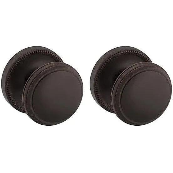 Baldwin Estate 5069 Passage Knob with 5076 Rosette in Venetian Bronze finish