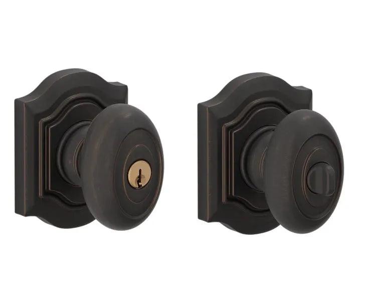 The Baldwin Estate 5237 Keyed Bethpage Knob with Bethpage Rosette in Venetian Bronze finish.