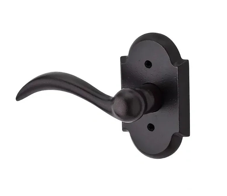 The Baldwin Reserve Arch Lever with Rustic Arch Rosette in Dark Bronze finish.