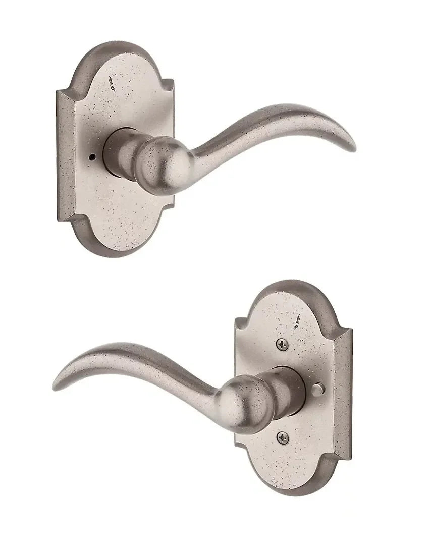 The Baldwin Reserve Arch Lever with Rustic Arch Rosette in White Bronze finish.