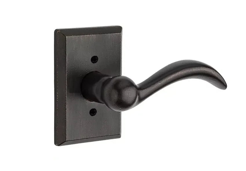 The Baldwin Reserve Arch Lever with Rustic Square Rosette in Dark Bronze finish.