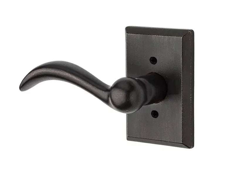 The Baldwin Reserve Arch Lever with Rustic Square Rosette in Dark Bronze finish.