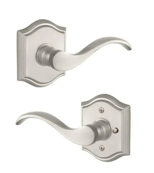 The Baldwin Reserve Curve Lever with Traditional Arch Rosette in Satin Nickel finish.