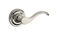 The Baldwin Reserve Curve Lever with Traditional Round Rosette in Lifetime Polished Nickel finish.