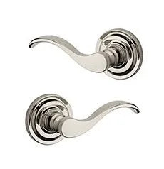 Baldwin Curve Lever with Traditional Round Rosette in Lifetime Polished Nickel finish