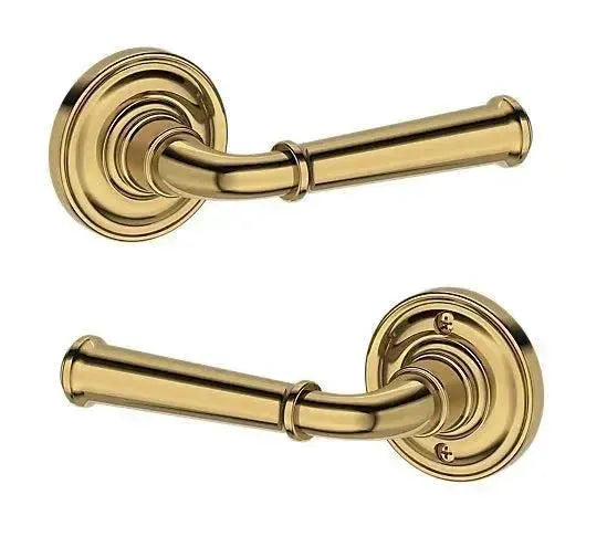 Baldwin Dunsmoor Lever with Traditional Round Rosette in Lifetime Polished Brass finish