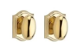 Baldwin Ellipse Knob with Traditional Arch Rosette Lifetime Polished Brass