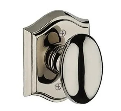 Baldwin Ellipse Knob with Traditional Arch Rosette Lifetime Polished Nickel