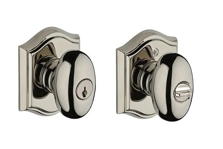 Baldwin Ellipse Knob with Traditional Arch Rosette Lifetime Polished Nickel