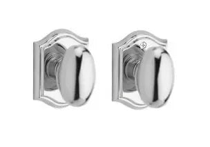 Baldwin Ellipse Knob with Traditional Arch Rosette Polished Chrome