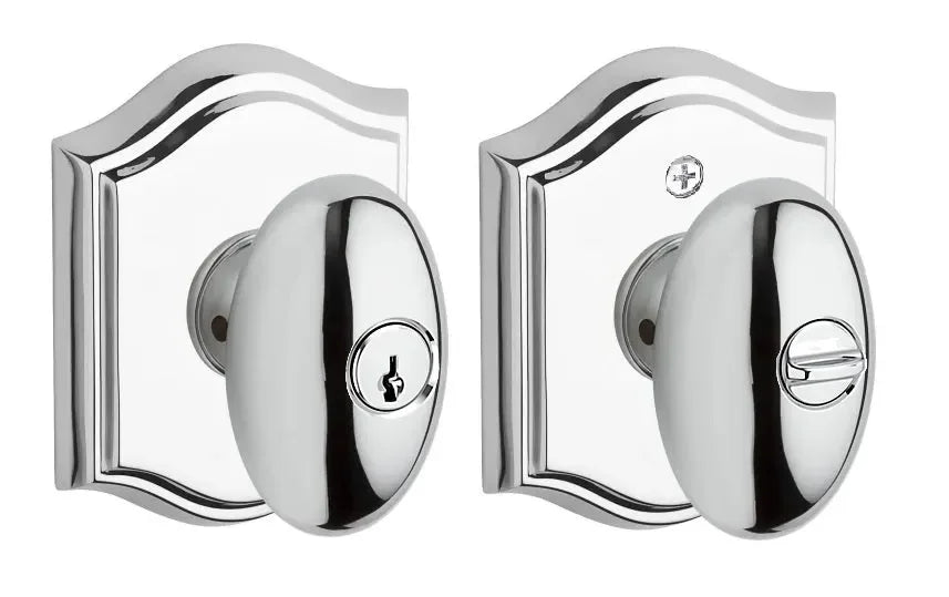Baldwin Ellipse Knob with Traditional Arch Rosette Polished Chrome