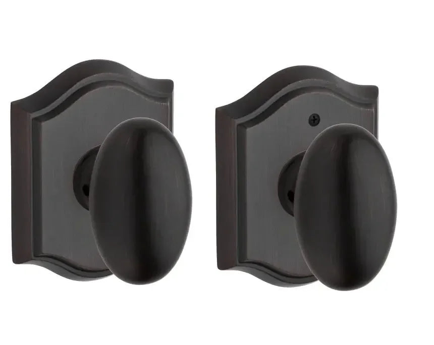 Baldwin Ellipse Knob with Traditional Arch Rosette Venetian Bronze