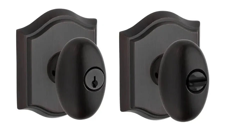 Baldwin Ellipse Knob with Traditional Arch Rosette Venetian Bronze
