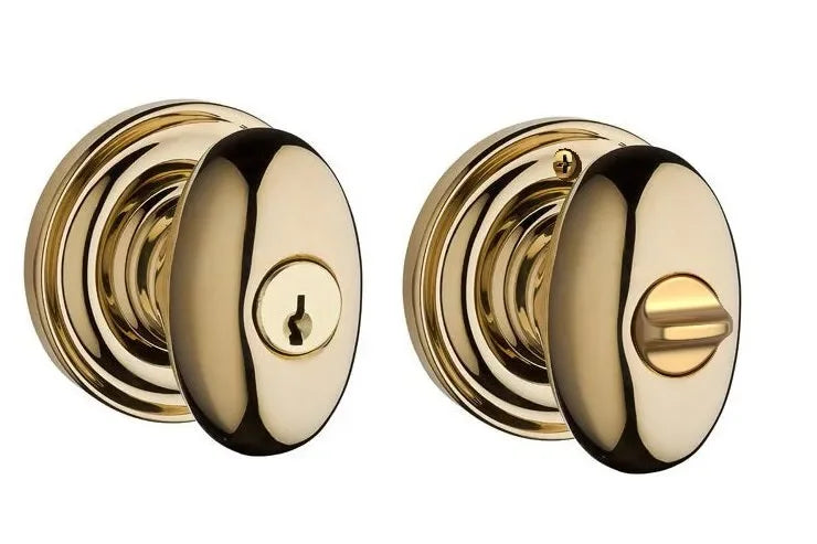 The Baldwin Reserve Ellipse Knob with Traditional Round Rosette in Lifetime Polished Brass finish.