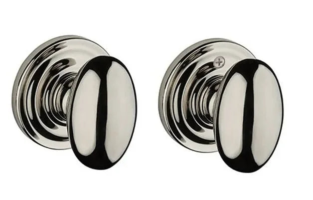 The Baldwin Reserve Ellipse Knob with Traditional Round Rosette in Lifetime Polished Nickel finish.