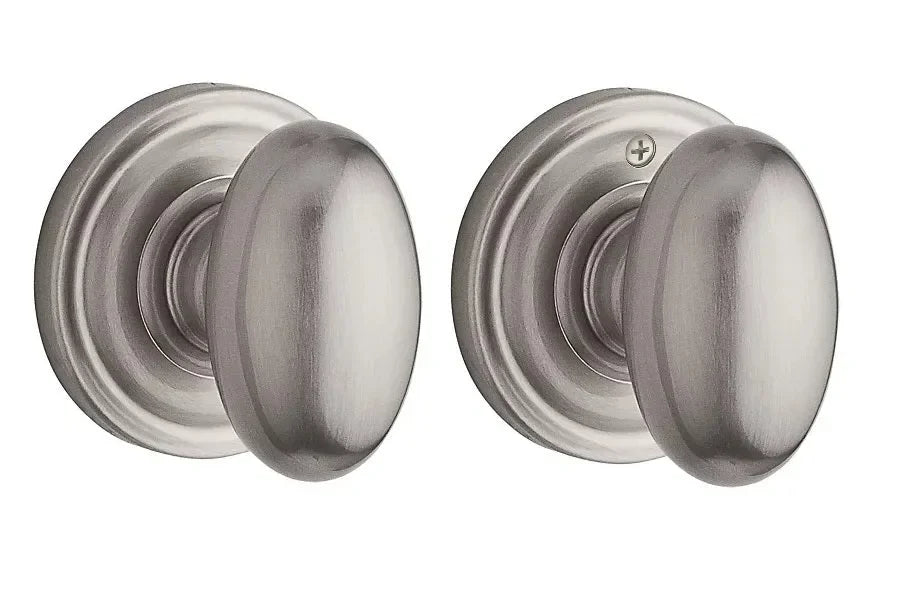 The Baldwin Reserve Ellipse Knob with Traditional Round Rosette in Satin Nickel finish.