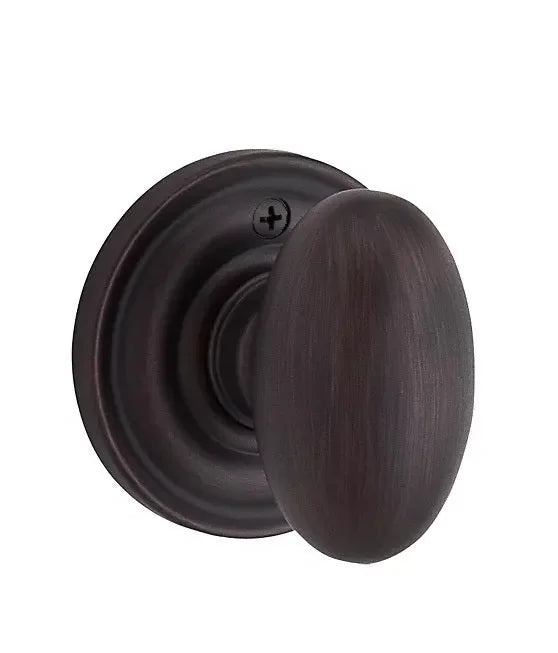 The Baldwin Reserve Ellipse Knob with Traditional Round Rosette in Venetian Bronze finish.