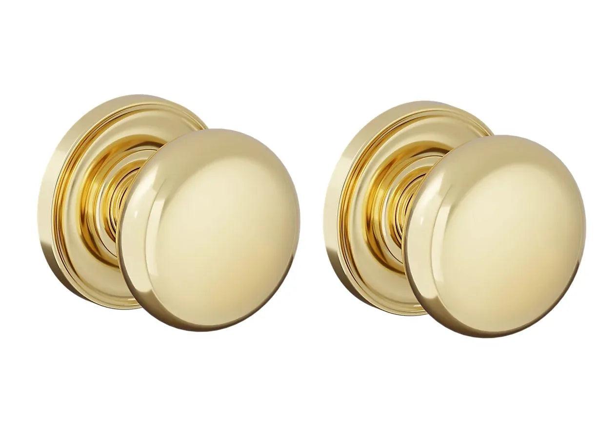 The Baldwin Estate 5083 Baltimore (2 1/2") Knob with 5048 Rosette in Lifetime Polished Brass finish.
