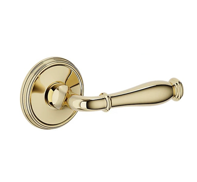 The Baldwin Estate L034 Nashville Lever with 5078 Rosette in Unlacquered Brass finish.