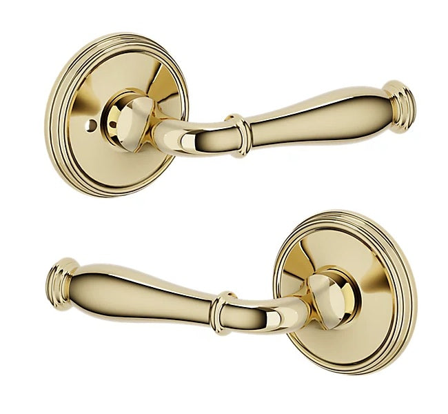 The Baldwin Estate L034 Nashville Lever with 5078 Rosette in Unlacquered Brass finish.