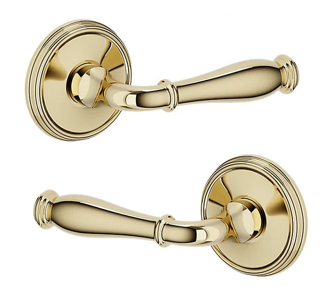The Baldwin Estate L034 Nashville Lever with 5078 Rosette in Unlacquered Brass finish.