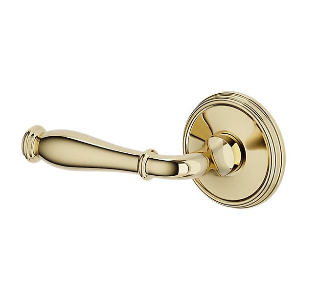 The Baldwin Estate L034 Nashville Lever with 5078 Rosette in Unlacquered Brass finish.