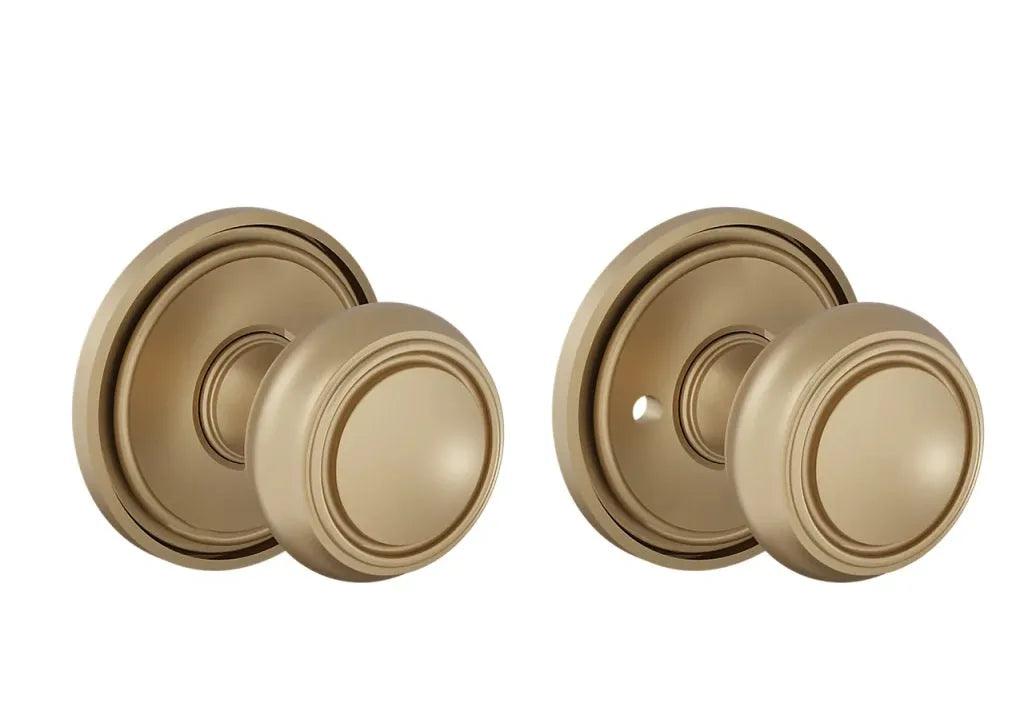 The Baldwin Estate 5087 Nashville Knob (2") with 5070 Rosette in Vintage Brass finish.