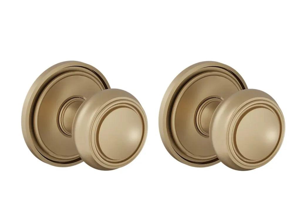The Baldwin Estate 5087 Nashville Knob (2") with 5070 Rosette in Vintage Brass finish.