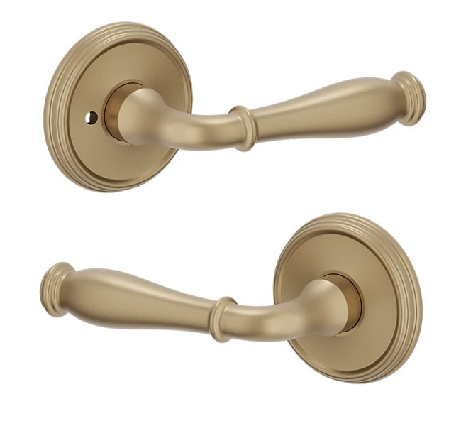 The Baldwin Estate L034 Nashville Lever with 5078 Rosette in Vintage Brass finish.