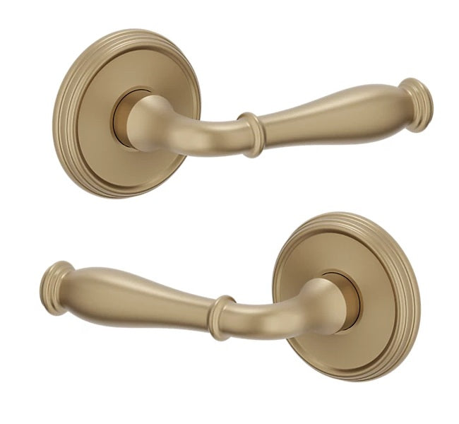 The Baldwin Estate L034 Nashville Lever with 5078 Rosette in Vintage Brass finish.