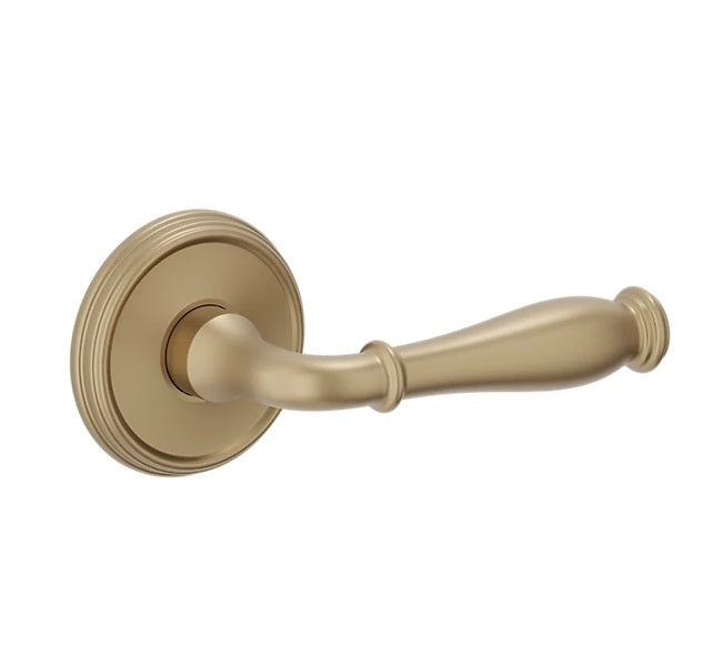 The Baldwin Estate L034 Nashville Lever with 5078 Rosette in Vintage Brass finish.