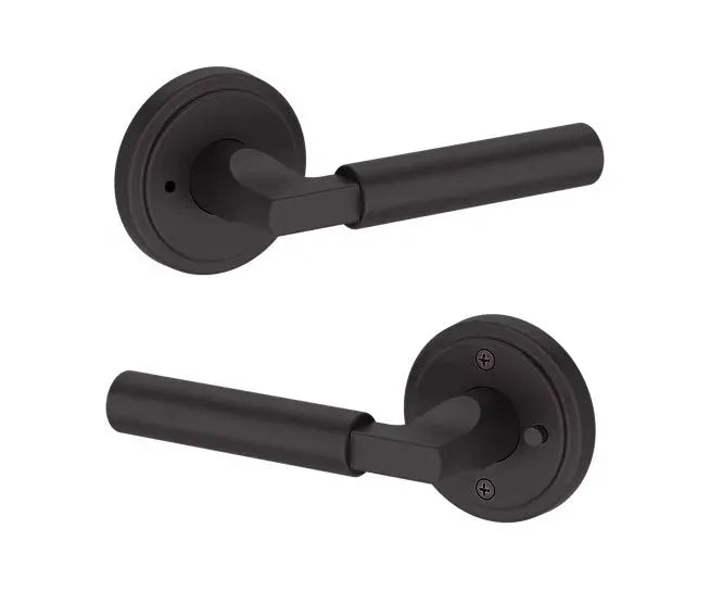 Baldwin Lake Forest Lever with Stepped Round Rosette in Venetian Bronze finish