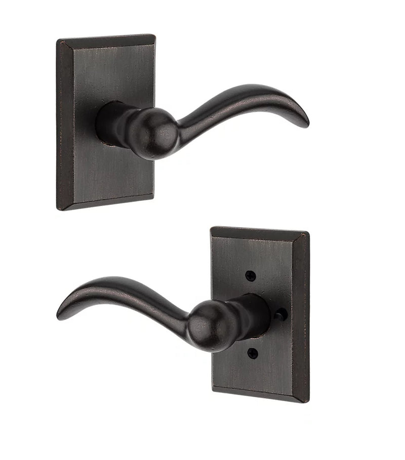 The Baldwin Reserve Arch Lever with Rustic Square Rosette in Dark Bronze finish.
