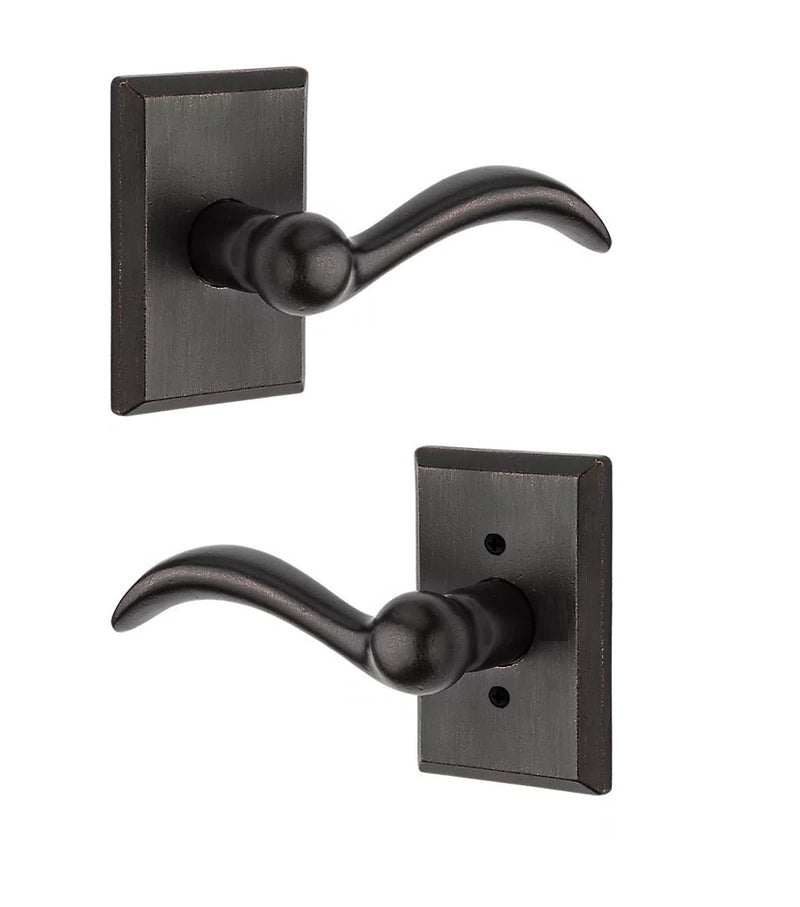 The Baldwin Reserve Arch Lever with Rustic Square Rosette in Dark Bronze finish.