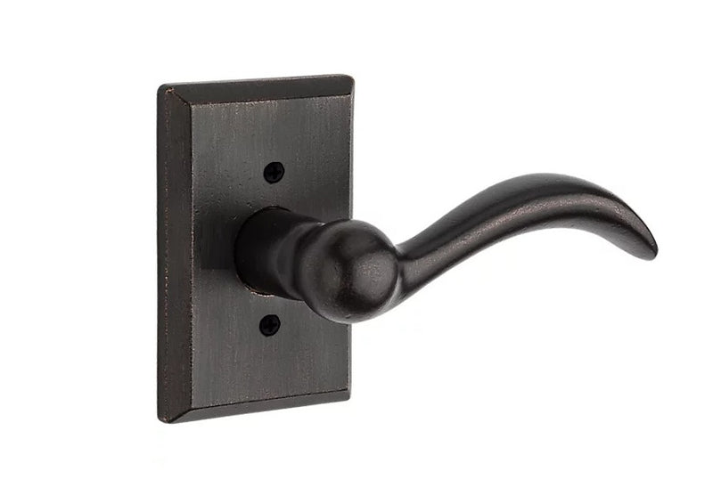 The Baldwin Reserve Arch Lever with Rustic Square Rosette in Dark Bronze finish.