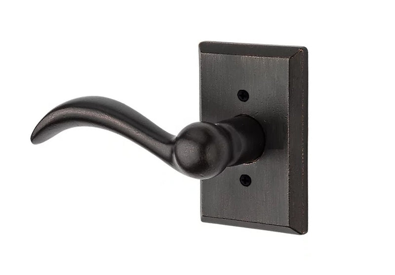 The Baldwin Reserve Arch Lever with Rustic Square Rosette in Dark Bronze finish.